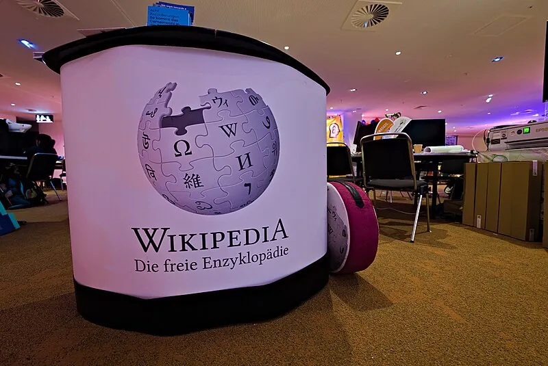 Photo of a large poster featuring the Wikipedia puzzle ball.