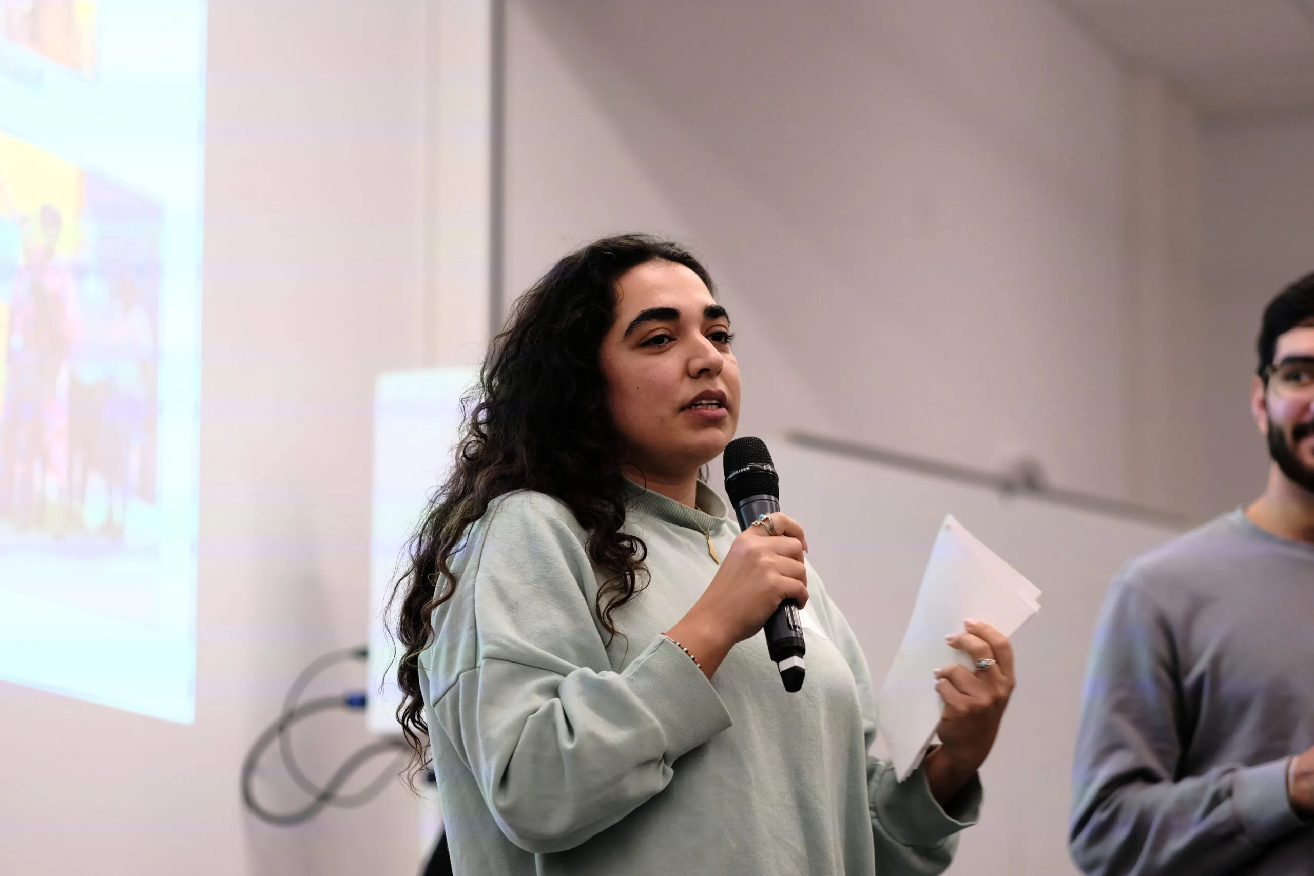 A person holding a microphone.