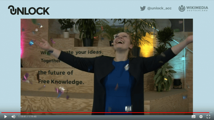 Photo still of the UNLOCK Demo Day 2021: The moderator Lucia Obst showered in confetti