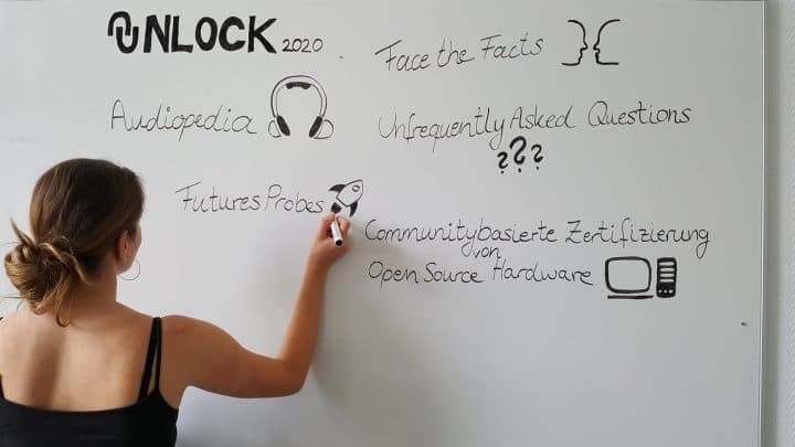 Whiteboard with the names of the UNLOCK projects supported in 2020